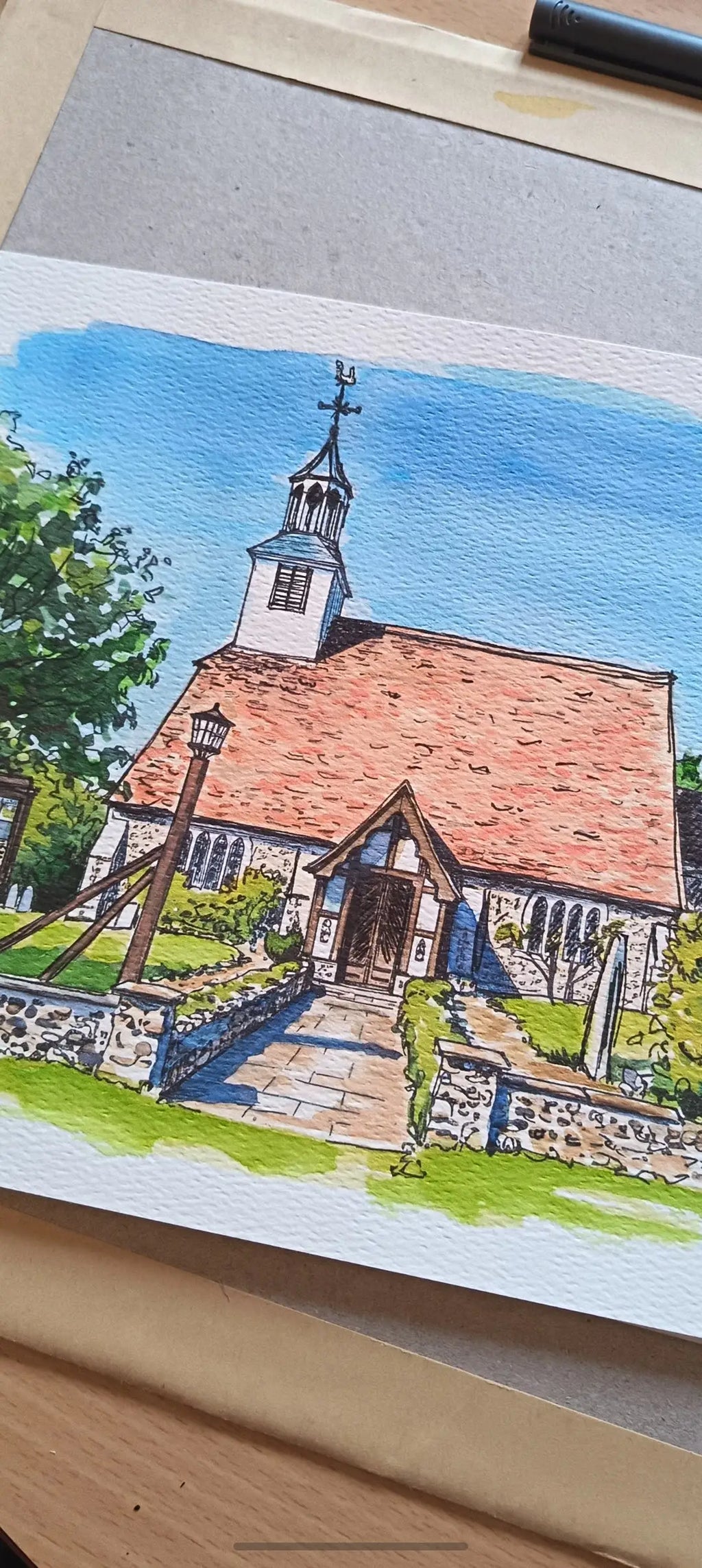 Art on a Wall custom watercolour wedding venue painting of a stone church with a red roof